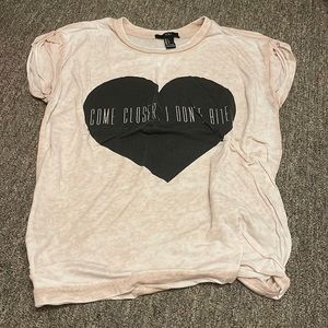 Size small pale pink tee with black heart